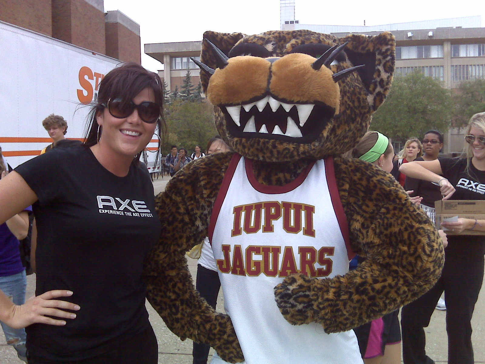 Woman posing with a mascot