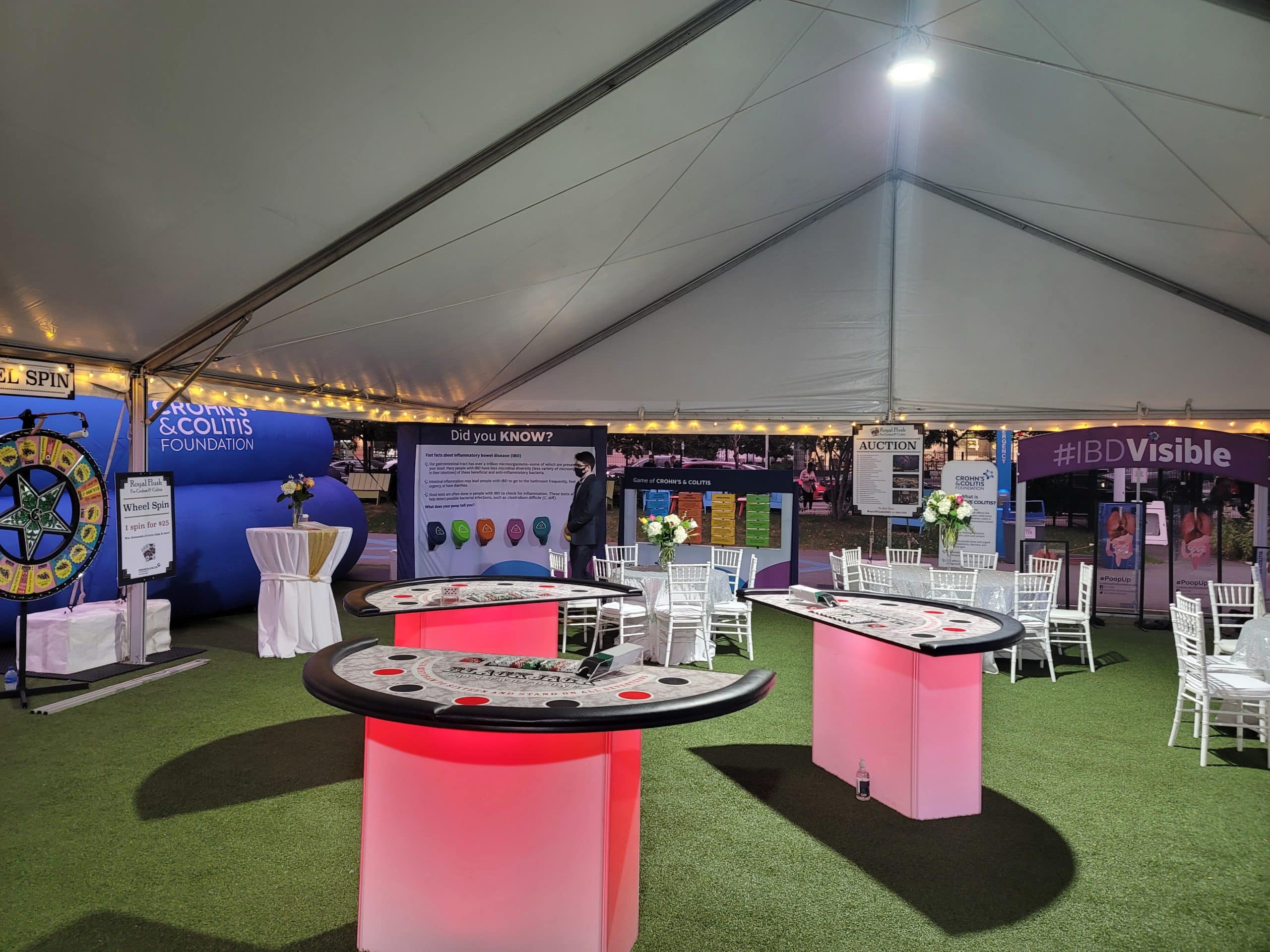 Crohn's and Colitis exhibits under a white tent