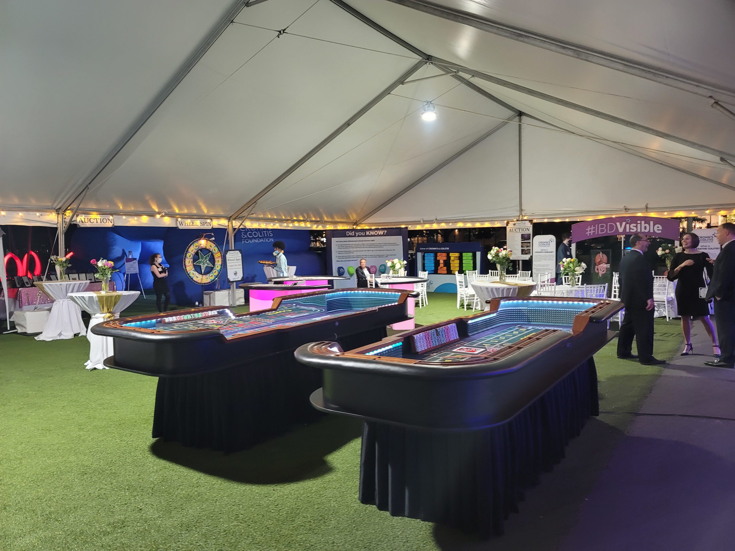 Crohn's and Colitis exhibits under a white tent