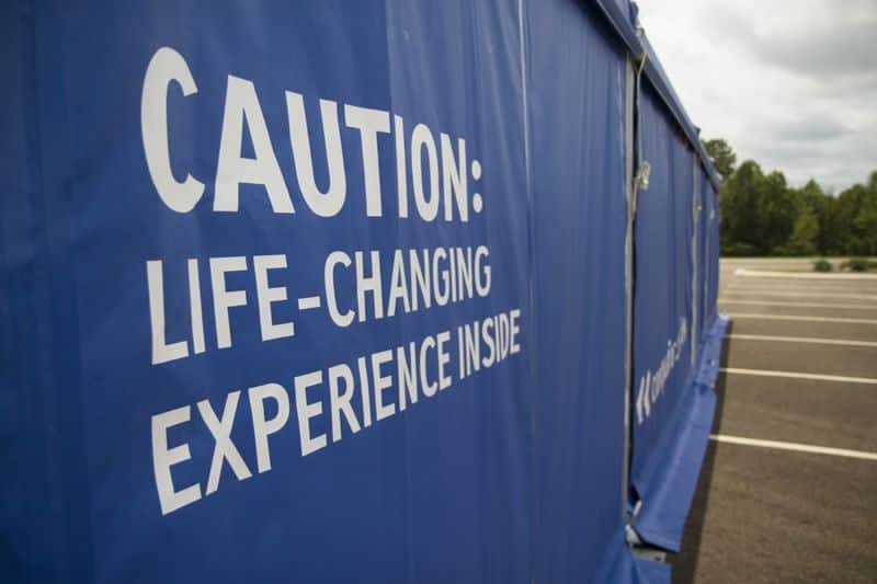 blue canopy with a caution sign