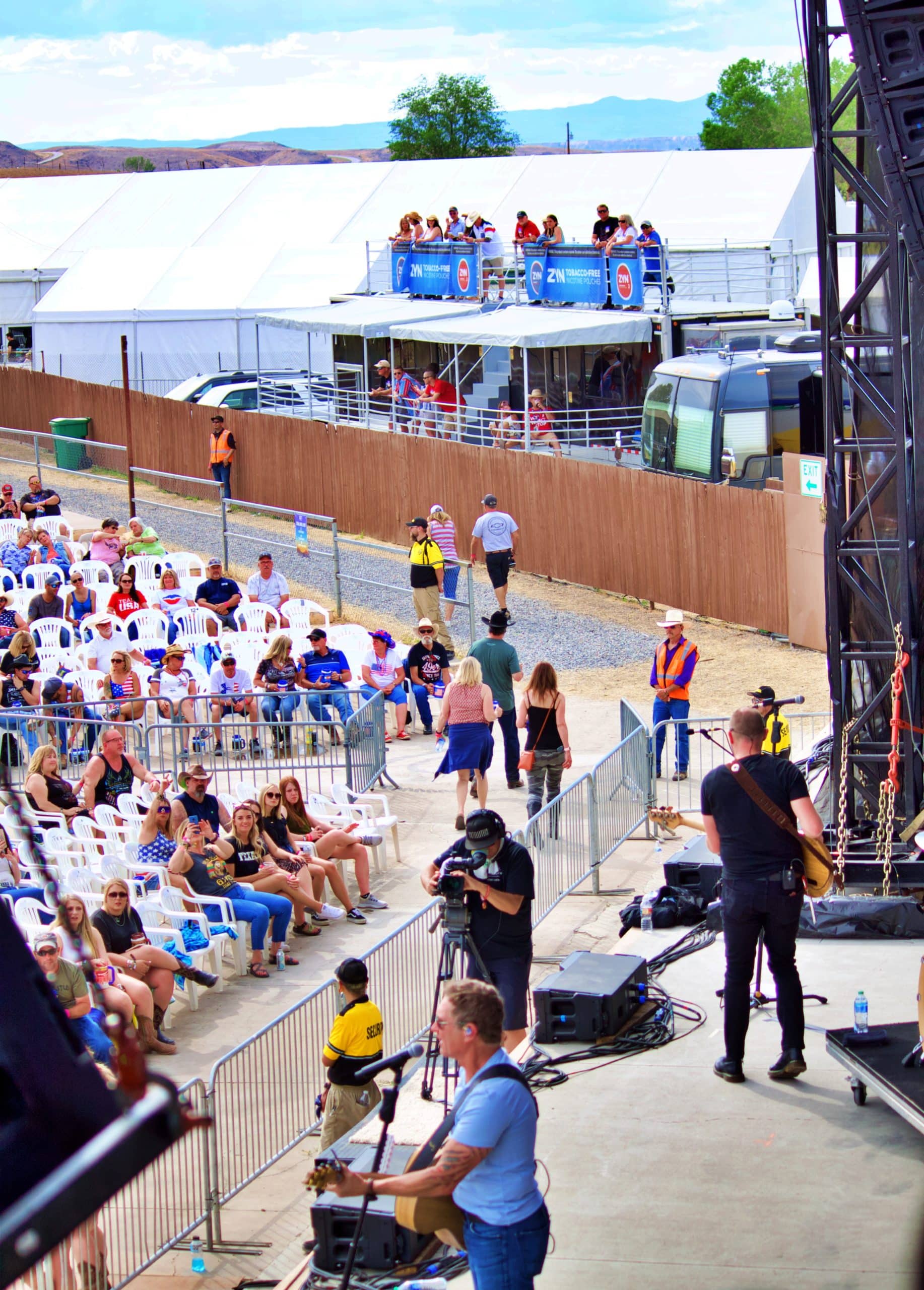 People gathered in front of a stage