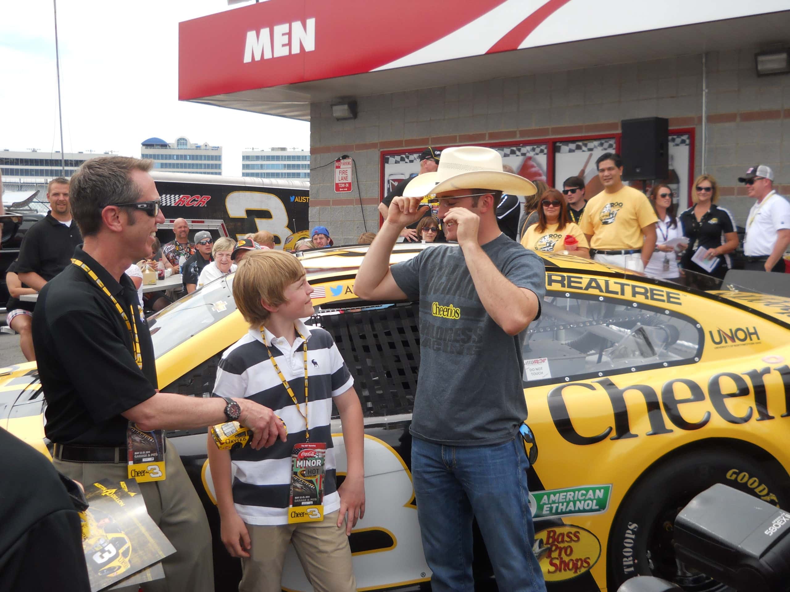 people gathered around a race car