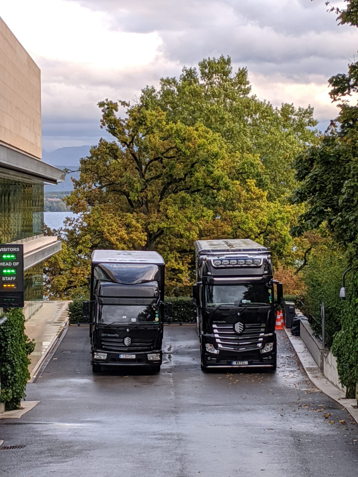Two black IBM trucks