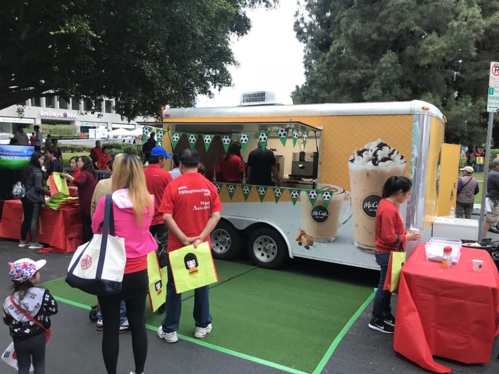 People lining up at a snack truck