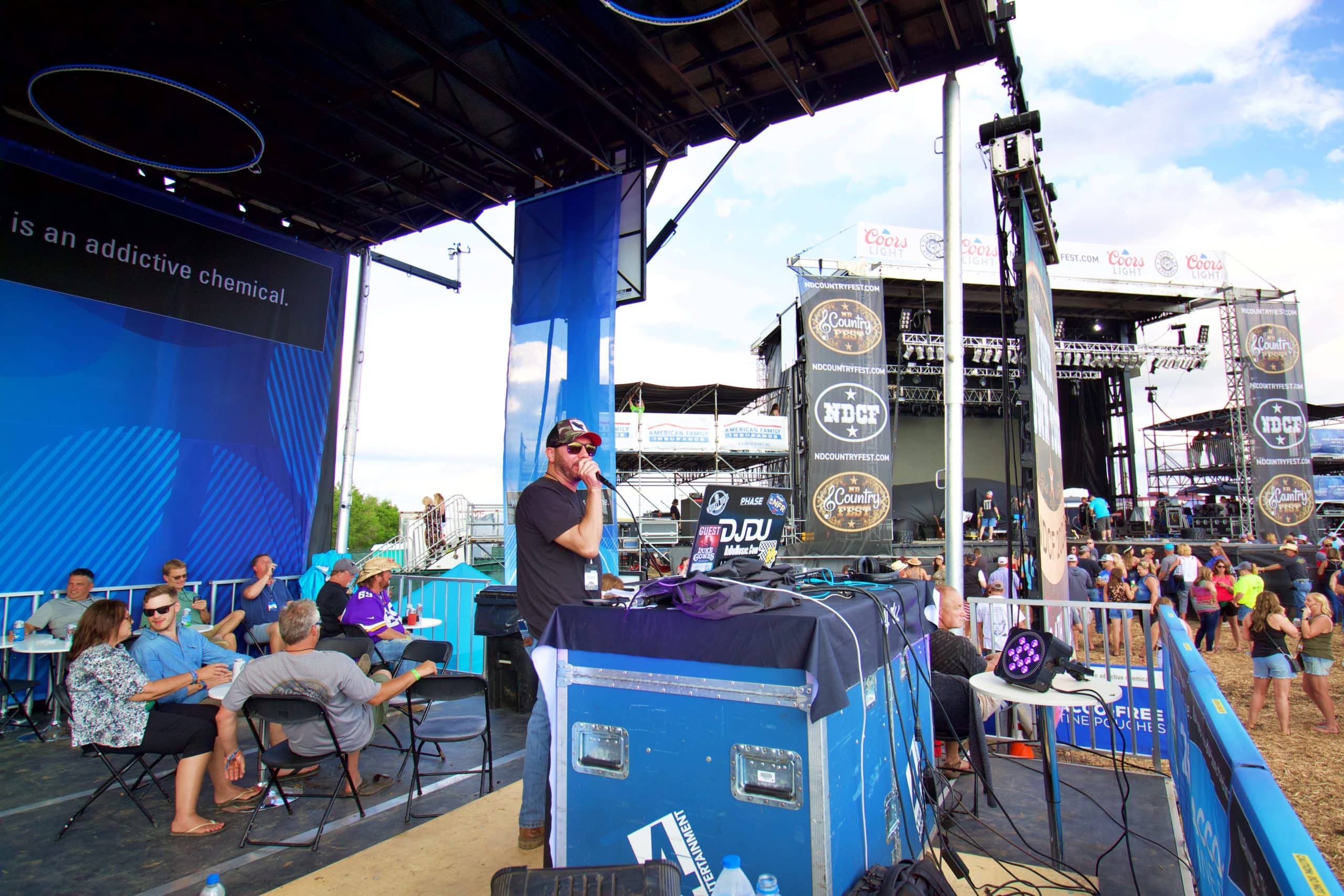 A DJ on a blue promobile