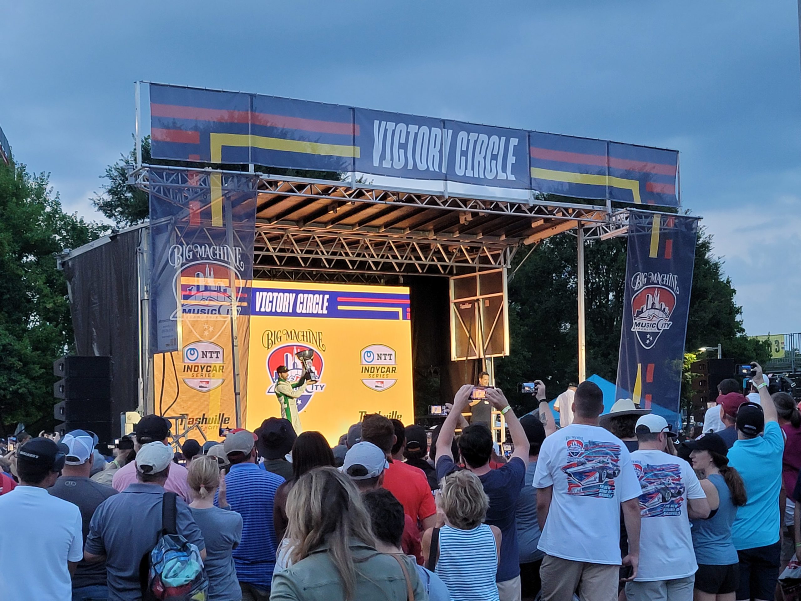 Crowd watching VictoryCircle driver celebration at Music City Grand Prix stage