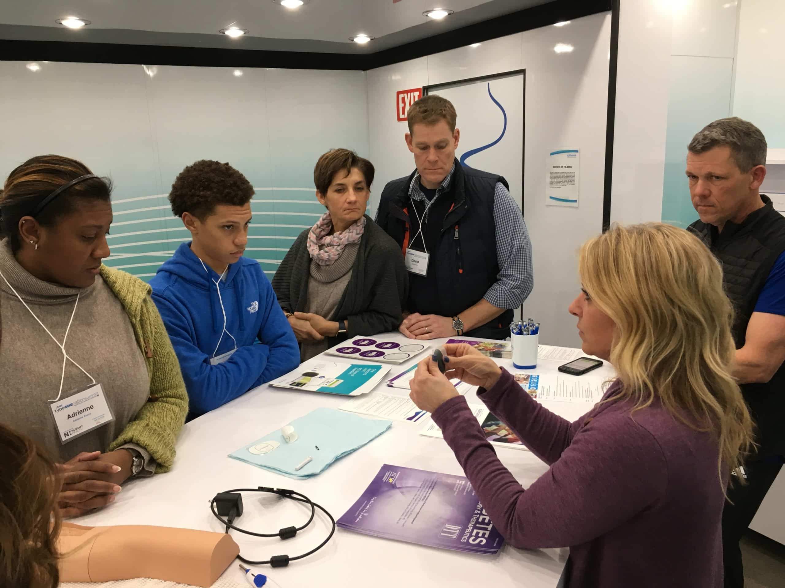 People sitting in Senseonics Mobile STEM Education trailer