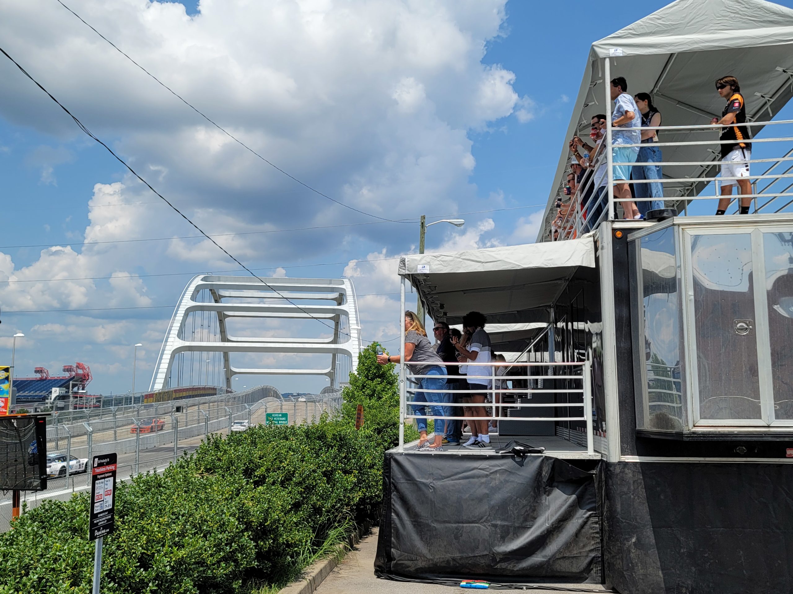 People on promobile double decks watching the tracks at Music City Grand Prix