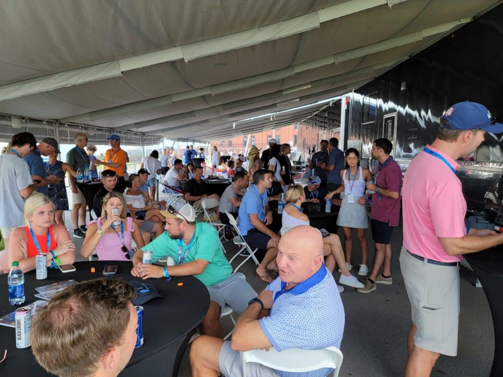 people gathered under a canopy area