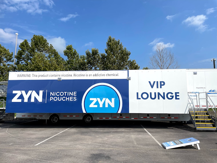 ZYN blue and white VIP Lounge mobile trailer