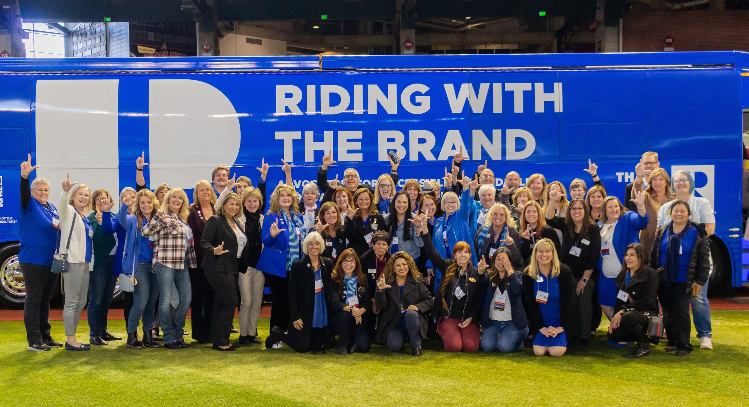 Group of people gathered in front of a of a BMG designed truck for the National Association of REALTORS®