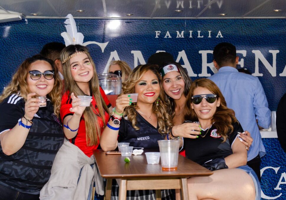 women posing with drinks